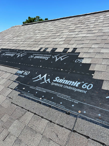 A close-up of shingle damage caused by a hailstorm in the Pace, FL area.